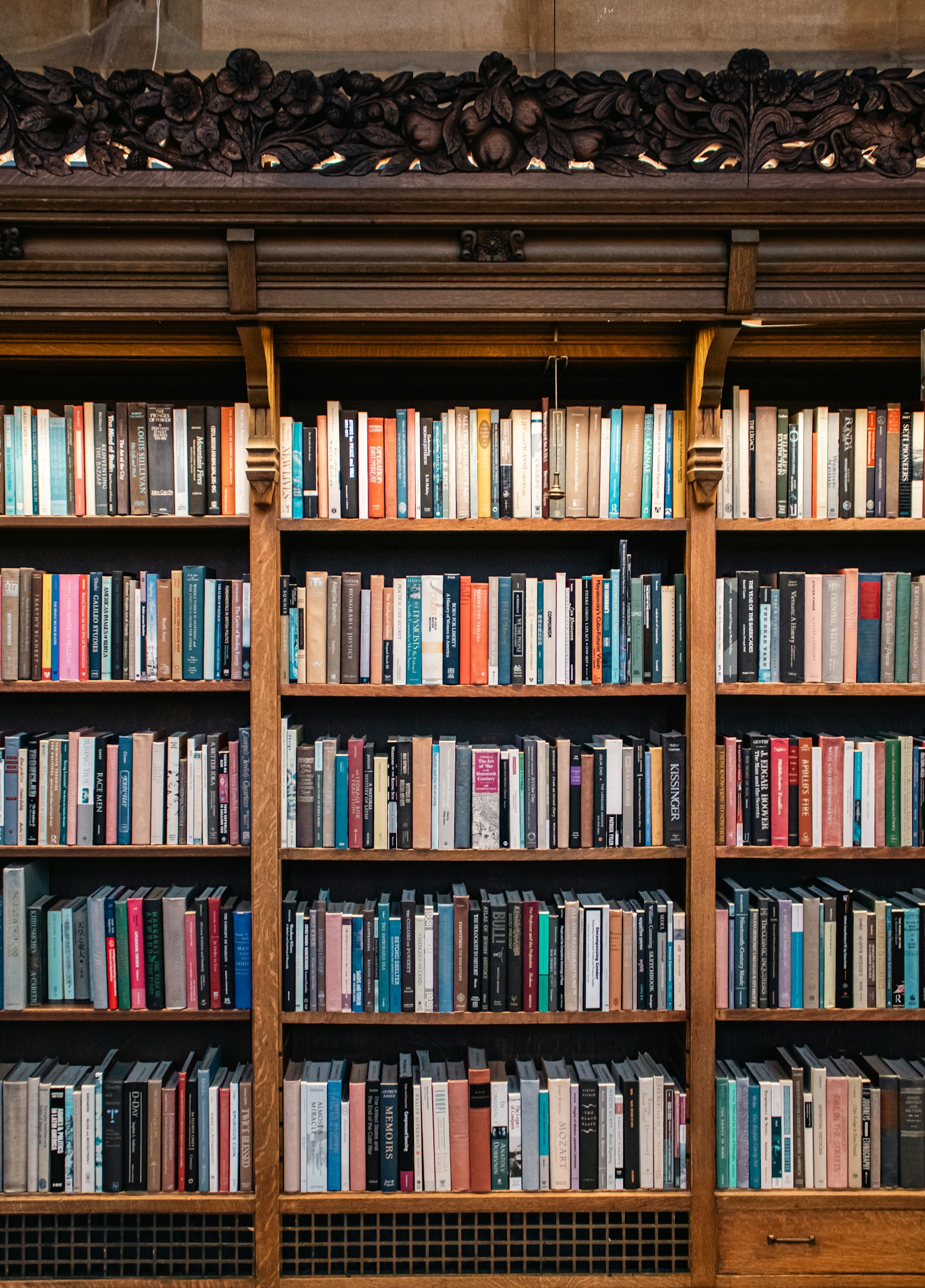 Richly carved wooden bookshelves at Suzzallo Library, University of Washington. Illustrative stock photograph.